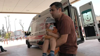 Elektrikli bisikletten düşen 2 yaşındaki Yusuf, oyuncağını bırakmadı