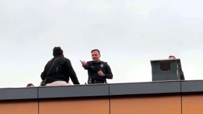 Çatıya çıkan kapıcıyı, başkomiser ikna etti